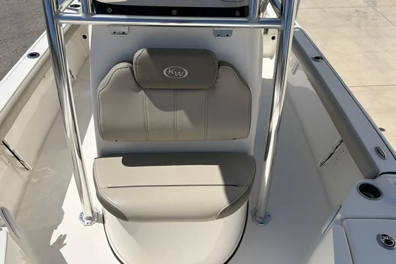 Slide: The Image of 2024 Key West 210 Bay Reef boat interior with cushioned seating and stainless steel frame. - 24
