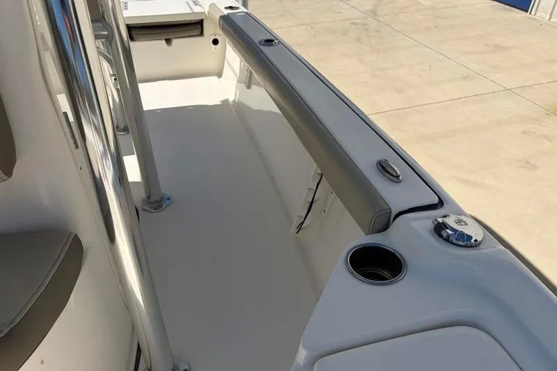 Slide: The Image of 2024 Key West 210 Bay Reef boat interior with seating and cup holder. - 25
