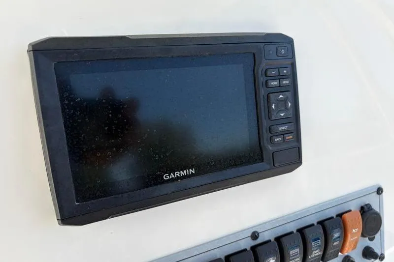 Slide: The Image of Garmin navigation system on 2024 Key West 210 Bay Reef boat dashboard. - 29