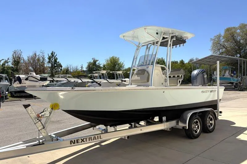 Slide: The Image of 2024 Key West 210 Bay Reef boat on Nextrail trailer in outdoor setting. - 3