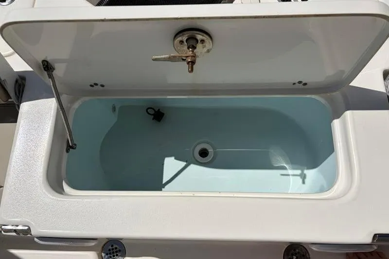 Slide: The Image of Open storage compartment on 2024 Key West 210 Bay Reef boat. - 37