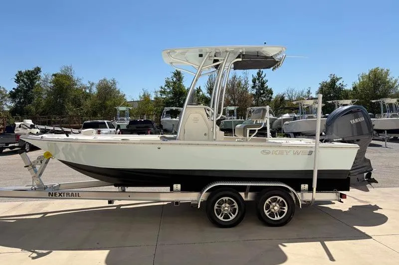Slide: The Image of 2024 Key West 210 Bay Reef boat on trailer, side view, outdoors. - 4