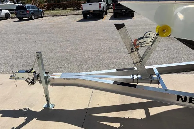 Slide: The Image of Trailer for 2024 Key West 210 Bay Reef boat in parking lot. - 40