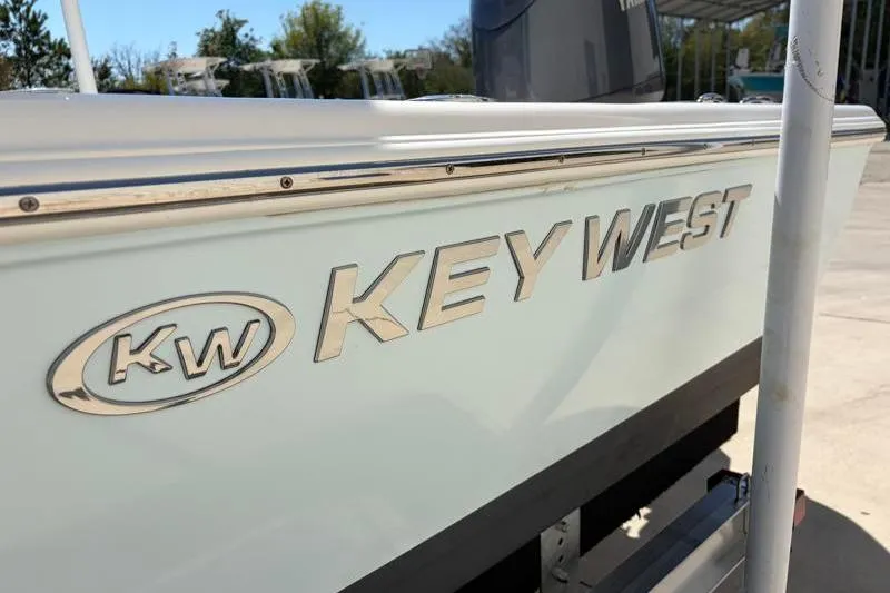 Slide: The Image of 2024 Key West 210 Bay Reef boat side view with logo in sunlight. - 43
