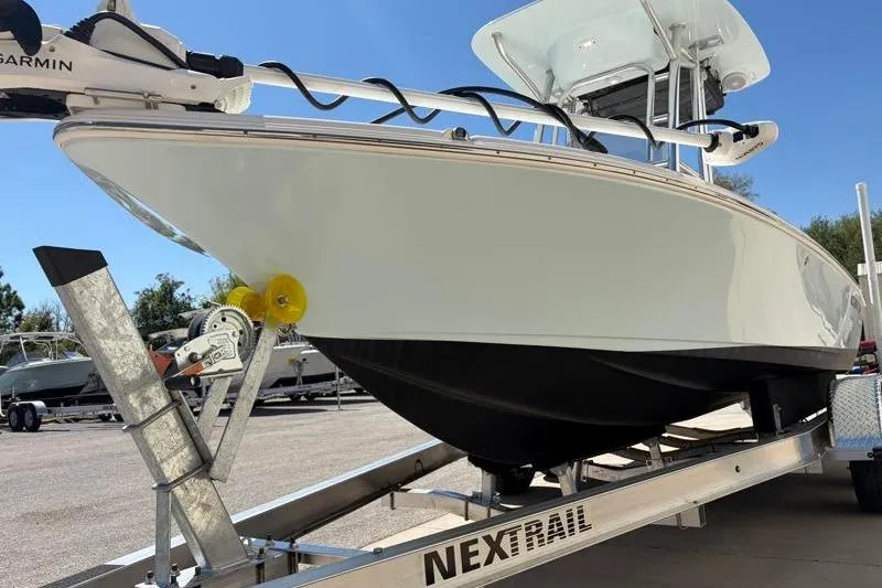 Slide: The Image of 2024 Key West 210 Bay Reef boat on trailer, featuring sleek design and Garmin equipment. - 9