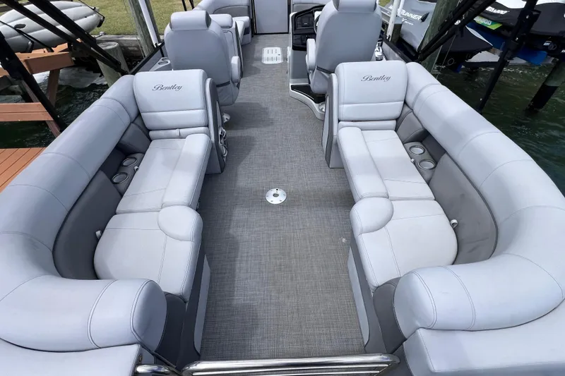 Slide: The Image of 2023 Bentley Pontoons 250 Elite Admiral interior with luxurious seating and modern design. - 13
