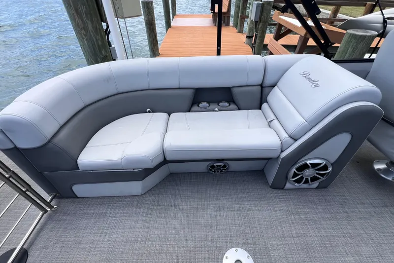 Slide: The Image of Luxurious seating on 2023 Bentley Pontoons 250 Elite Admiral, featuring sleek design and integrated speakers. - 18