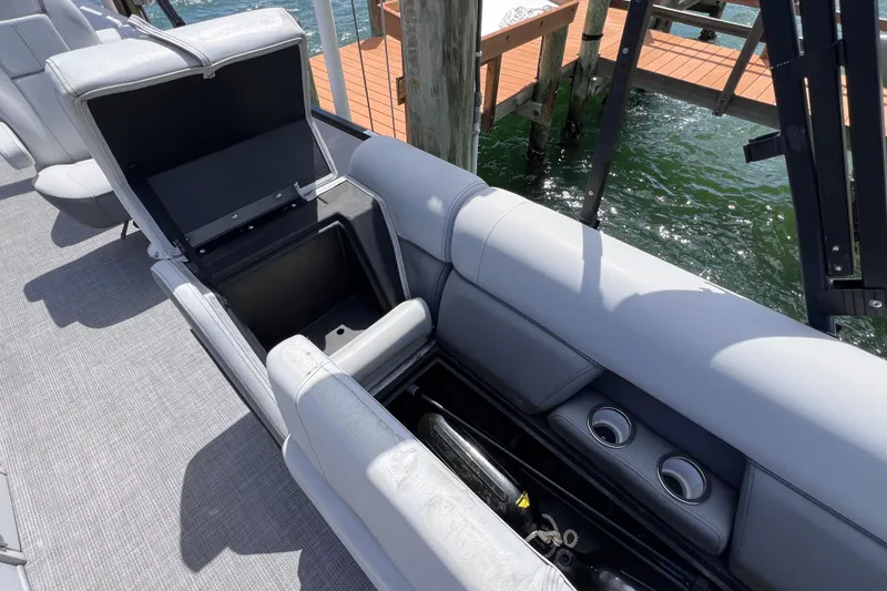 Slide: The Image of 2023 Bentley Pontoons 250 Elite Admiral with open storage compartment on deck. - 28