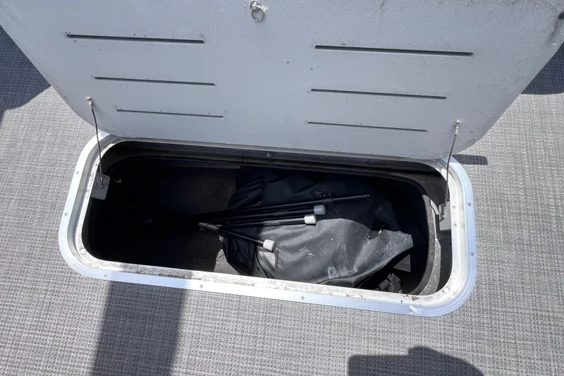 Slide: The Image of Storage compartment in Bentley Pontoons 250 Elite Admiral 2023. - 30