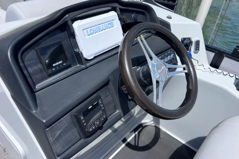 Slide: The Image of Steering console of 2023 Bentley Pontoons 250 Elite Admiral with navigation equipment. - 34