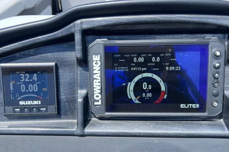 Slide: The Image of Dashboard of 2023 Bentley Pontoons 250 Elite Admiral with Lowrance and Suzuki displays. - 37