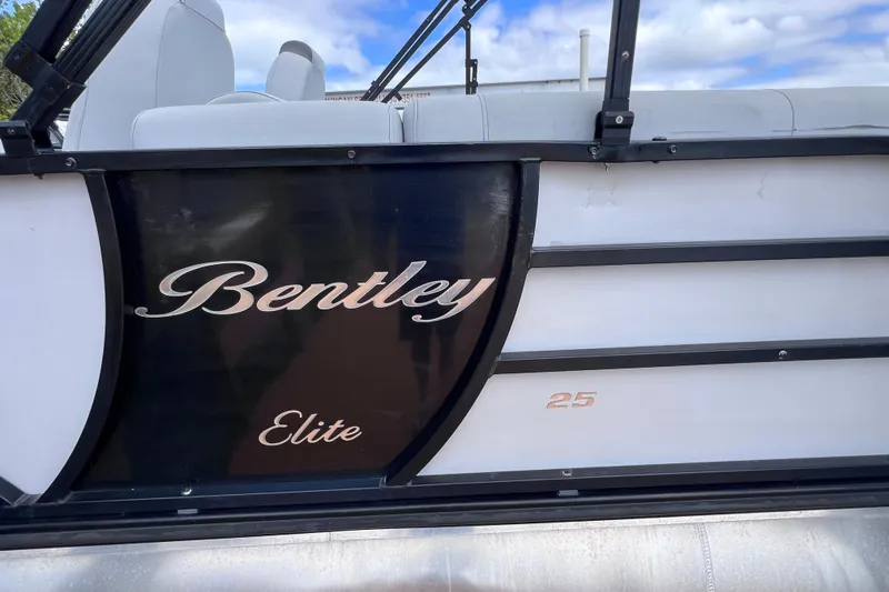 Slide: The Image of 2023 Bentley Pontoons 250 Elite Admiral side view with logo. - 48