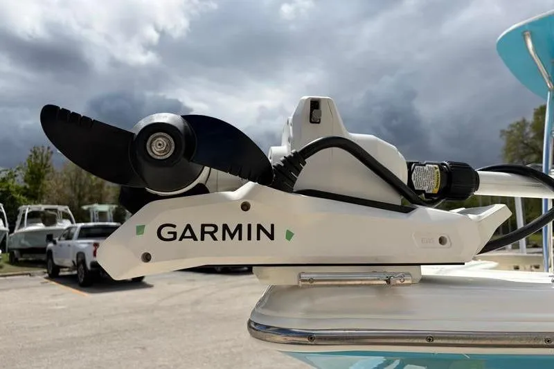 Slide: The Image of Garmin trolling motor on 2025 Key West 210 Bay Reef boat under cloudy sky. - 10