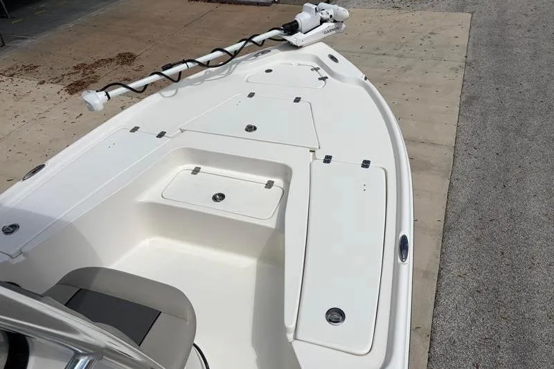 Slide: The Image of 2025 Key West 210 Bay Reef boat deck with storage compartments and trolling motor. - 20