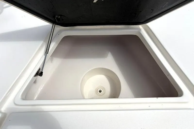Slide: The Image of Open storage compartment on 2025 Key West 210 Bay Reef boat. - 22