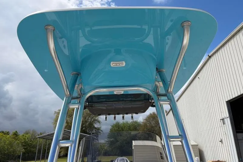 Slide: The Image of 2025 Key West 210 Bay Reef boat with blue T-top and stainless steel supports. - 28