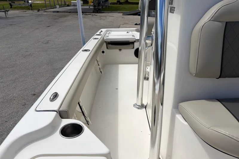 Slide: The Image of 2025 Key West 210 Bay Reef boat interior with seating and cup holders. - 29