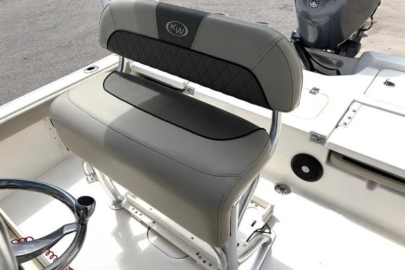 Slide: The Image of 2025 Key West 210 Bay Reef boat seat with gray upholstery and stainless steel frame. - 34