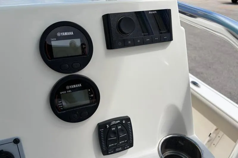 Slide: The Image of Dashboard of 2025 Key West 210 Bay Reef with Yamaha gauges and Fusion audio controls. - 39