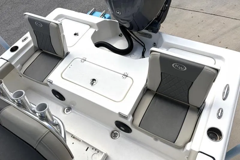 Slide: The Image of 2025 Key West 210 Bay Reef boat interior with seating and storage compartments. - 42