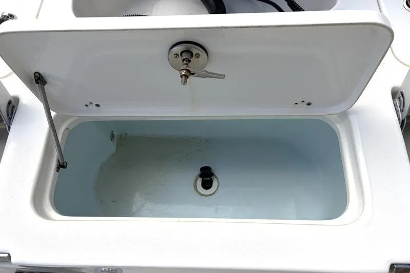 Slide: The Image of Open storage compartment on 2025 Key West 210 Bay Reef boat. - 43