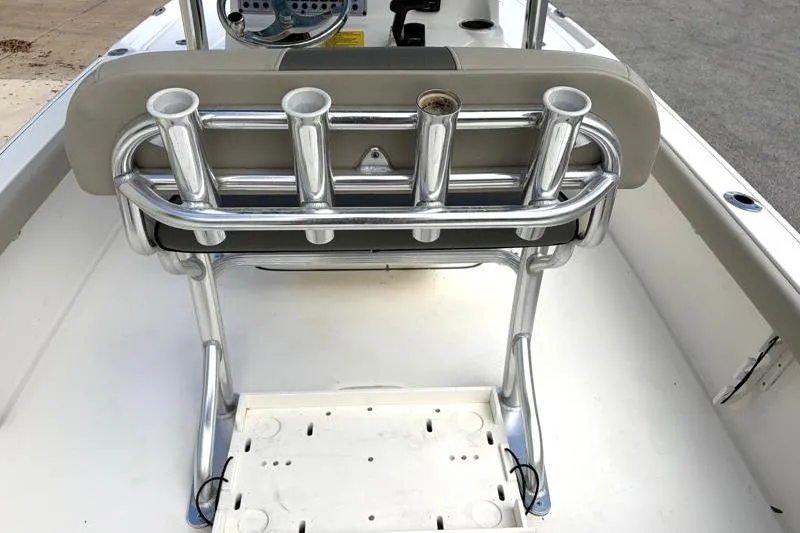 Slide: The Image of 2025 Key West 210 Bay Reef boat interior with rod holders and console. - 44