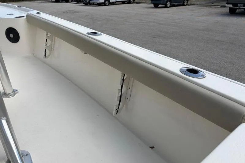 Slide: The Image of 2025 Key West 210 Bay Reef boat interior with rod holders and sleek design. - 46