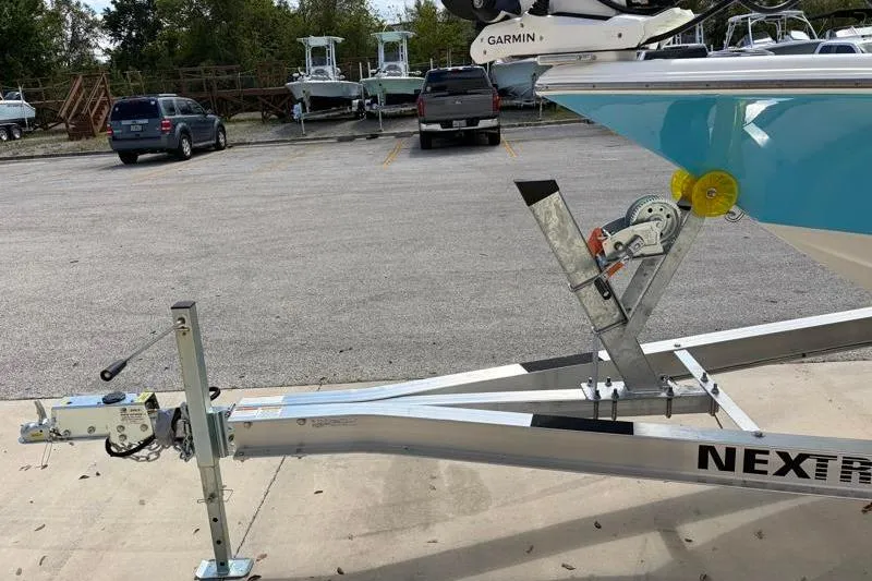 Slide: The Image of 2025 Key West 210 Bay Reef boat on trailer in parking lot. - 48