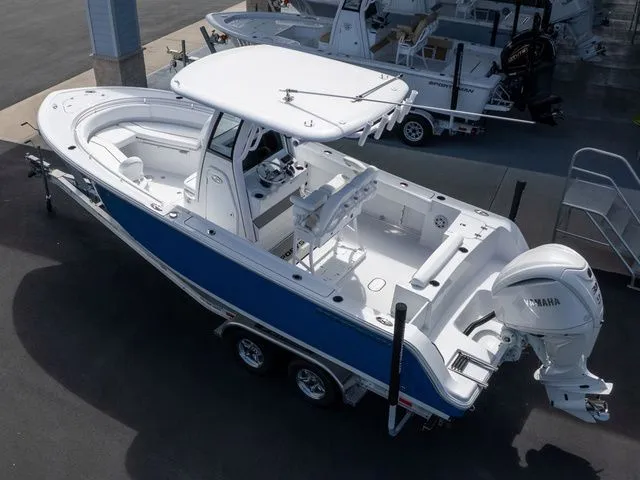 Slide: The Image of 2026 Sportsman Open 232 Center Console boat on trailer. - 10