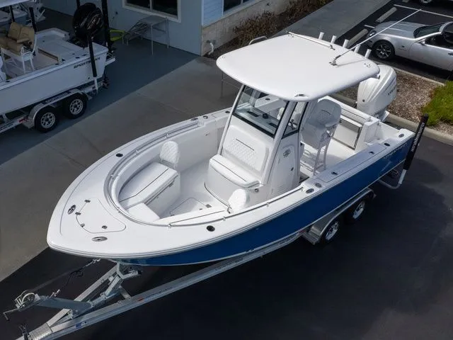 Slide: The Image of 2026 Sportsman Open 232 Center Console on trailer, white and blue design. - 12