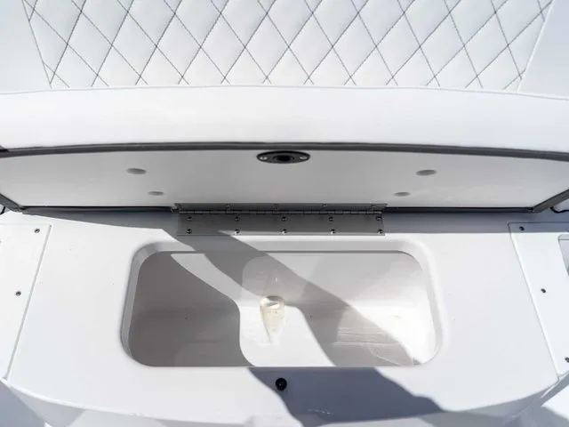 Slide: The Image of 2026 Sportsman Open 232 Center Console storage with cushioned seating. - 20