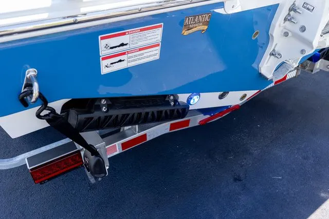 Slide: The Image of Rear view of a 2026 Sportsman Open 232 Center Console boat. - 24