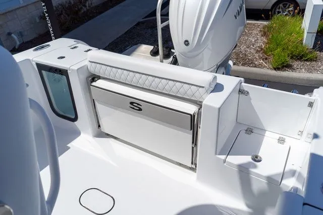 Slide: The Image of Sportsman Open 232 Center Console 2026 with white seating and motor. - 27
