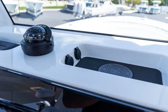Slide: The Image of Compass and charging pad on Sportsman Open 232 Center Console 2026. - 35