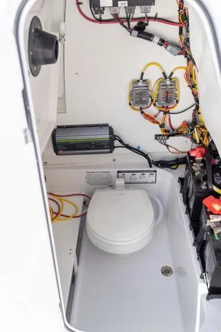 Slide: The Image of Interior of 2026 Sportsman Open 232 Center Console with electronics and toilet. - 43