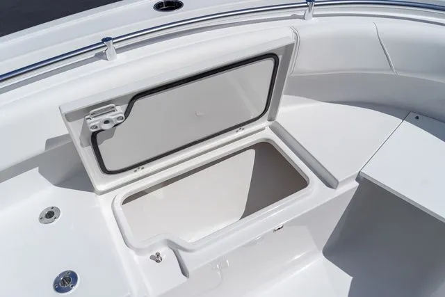 Slide: The Image of Sportsman Open 232 Center Console 2026 bow storage compartment. - 45