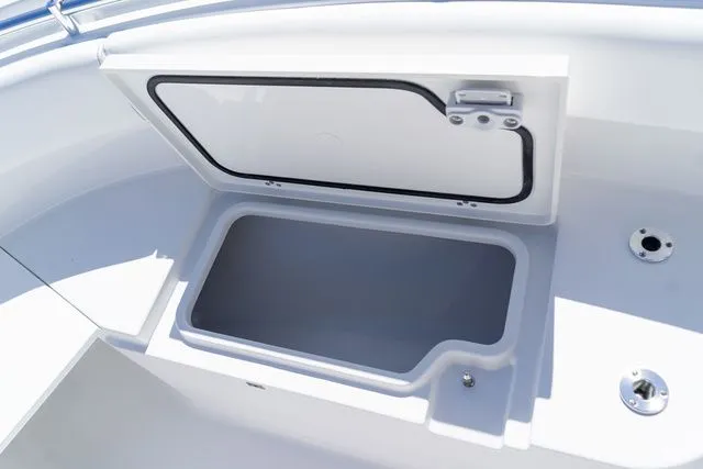 Slide: The Image of Open storage compartment on Sportsman Open 232 Center Console 2026. - 46