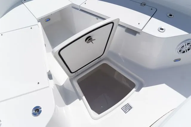 Slide: The Image of 2026 Sportsman Open 232 Center Console storage compartment open. - 47