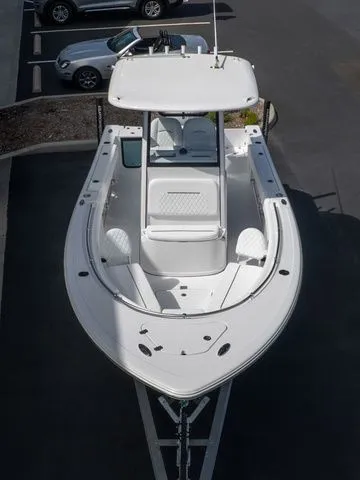 Slide: The Image of 2026 Sportsman Open 232 Center Console boat in parking lot. - 6