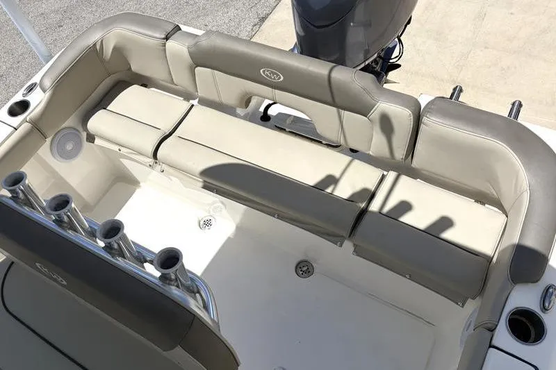 Slide: The Image of 2024 Key West 203 FS boat interior with cushioned seating and rod holders. - 35