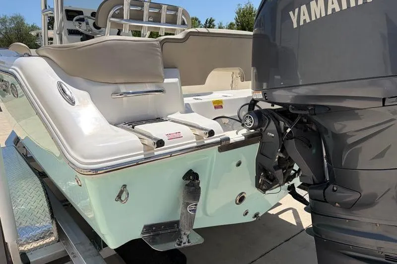 Slide: The Image of 2024 Key West 203 FS boat with Yamaha outboard motor on trailer. - 13