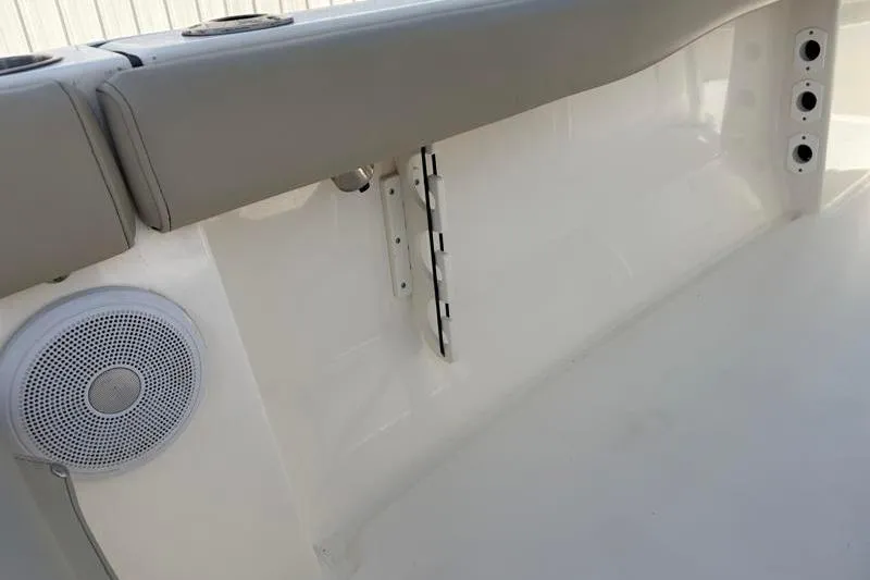 Slide: The Image of 2024 Key West 203 FS boat interior with speaker and rod holders. - 38