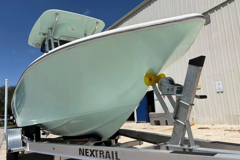 Slide: The Image of 2024 Key West 203 FS boat on trailer outside a building. - 10