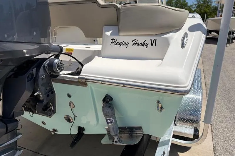 Slide: The Image of 2024 Key West 203 FS boat with "Playing Hooky VI" name on the stern. - 14