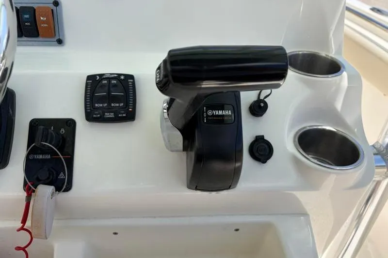 Slide: The Image of 2024 Key West 203 FS boat console with Yamaha controls and cup holders. - 33