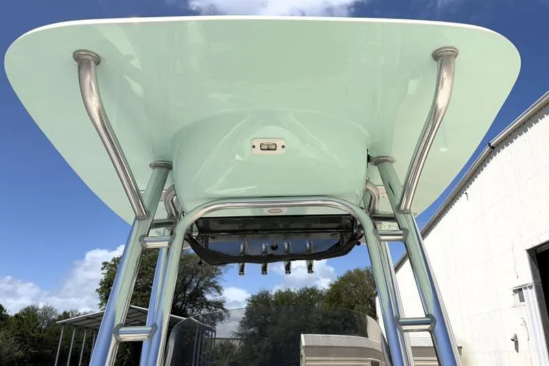 Slide: The Image of 2024 Key West 203 FS boat T-top with stainless steel supports under blue sky. - 23