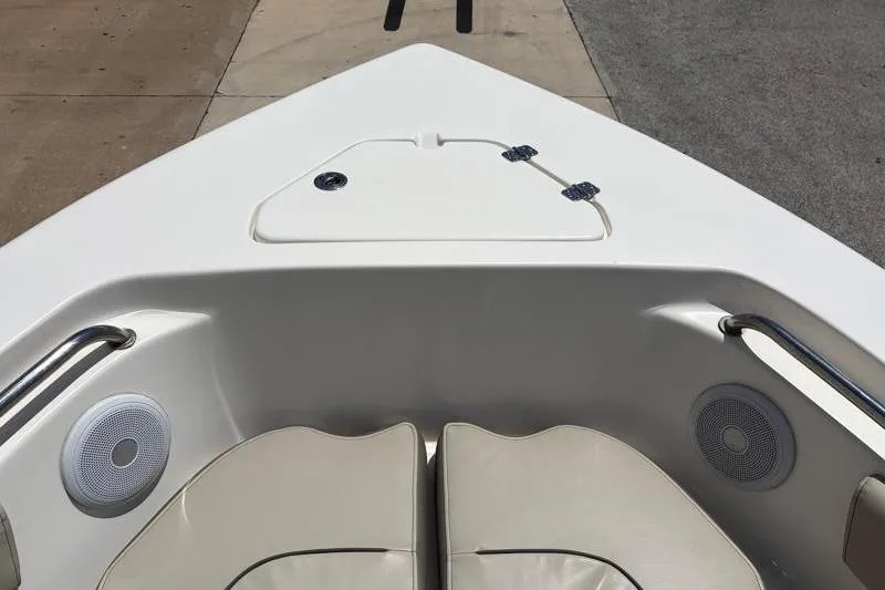 Slide: The Image of 2024 Key West 203 FS boat interior with cushioned seating and speakers. - 21