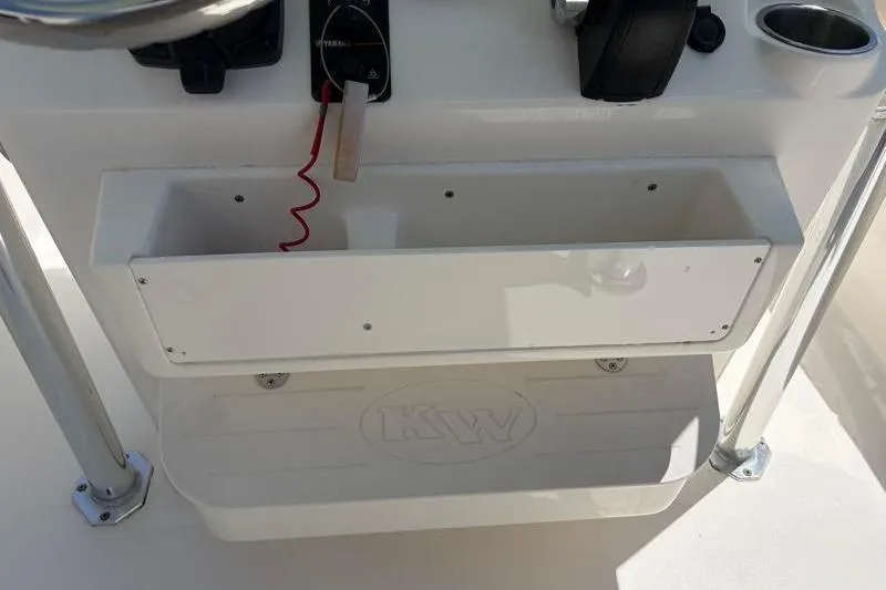 Slide: The Image of Control panel of 2024 Key West 203 FS boat with storage compartment. - 34
