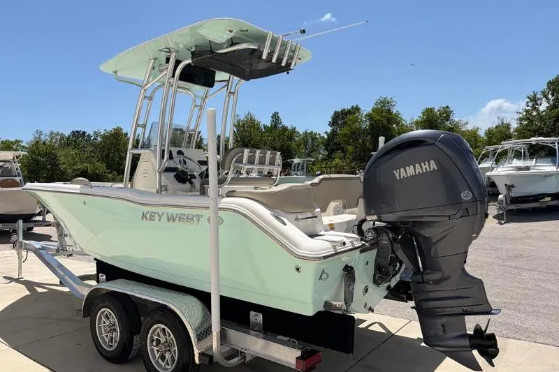 Slide: The Image of 2024 Key West 203 FS boat with Yamaha engine on trailer, outdoors. - 6