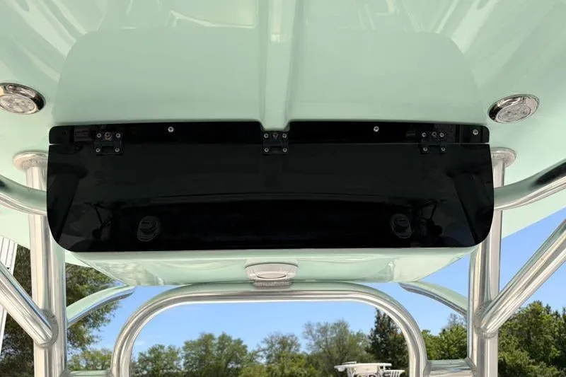 Slide: The Image of 2024 Key West 203 FS boat canopy with sleek black panel and sturdy metal frame. - 28